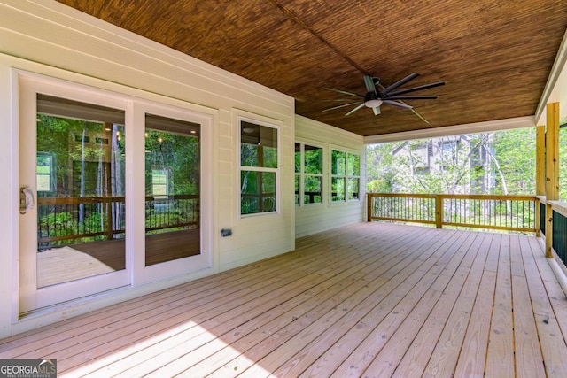 wooden deck with a ceiling fan