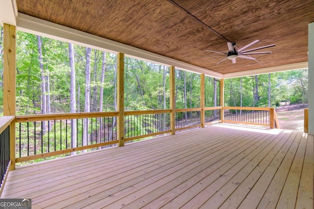 stairway featuring baseboards, ceiling fan with notable chandelier, wood finished floors, and visible vents