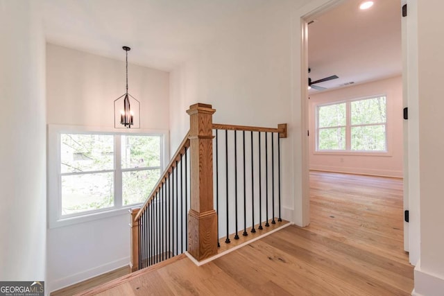 unfurnished bedroom with baseboards, light wood-style flooring, and visible vents