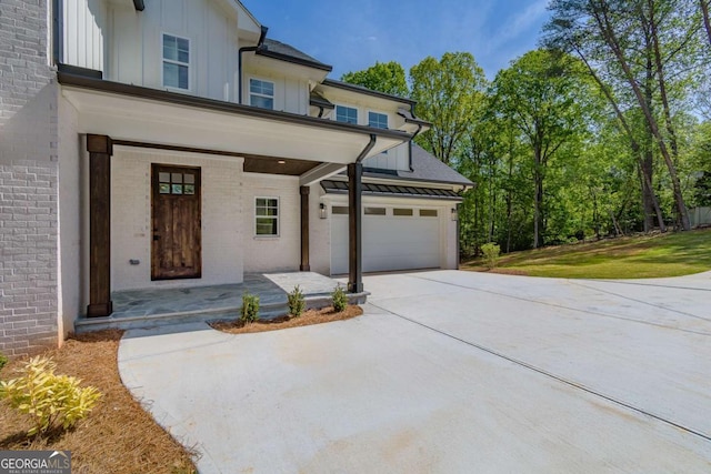 5734 Nix Bridge Rd, Gainesville, GA 30506 - view of front facade with board and batten siding, brick siding, a porch, and concrete driveway