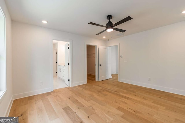 5734 Nix Bridge Rd, Gainesville, GA 30506 - unfurnished bedroom with light wood-type flooring, a spacious closet, recessed lighting, connected bathroom, and a closet