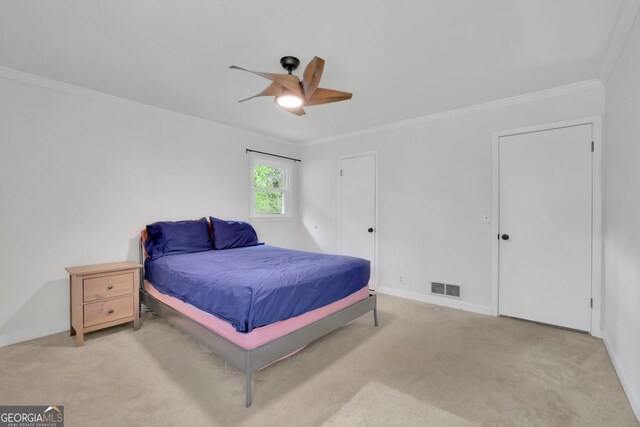 4420 Lake Breeze Dr, Stone Mountain, GA 30083 - carpeted bedroom with crown molding, baseboards, visible vents, and ceiling fan