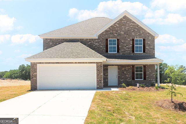 404 Clayton Scott St, Warner Robins, GA 31088 - view of front of house with a shingled roof, a front yard, and brick siding