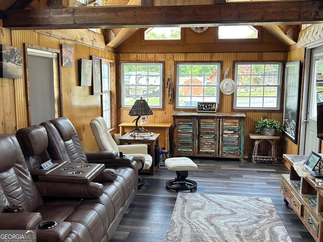 living area with dark wood-style flooring, lofted ceiling with beams, and wood walls