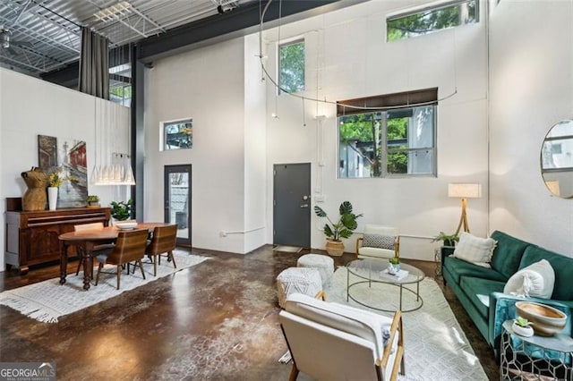195 Arizona Ave Unit 104, Atlanta, GA 30307 - interior space featuring a high ceiling, finished concrete floors, and a wealth of natural light