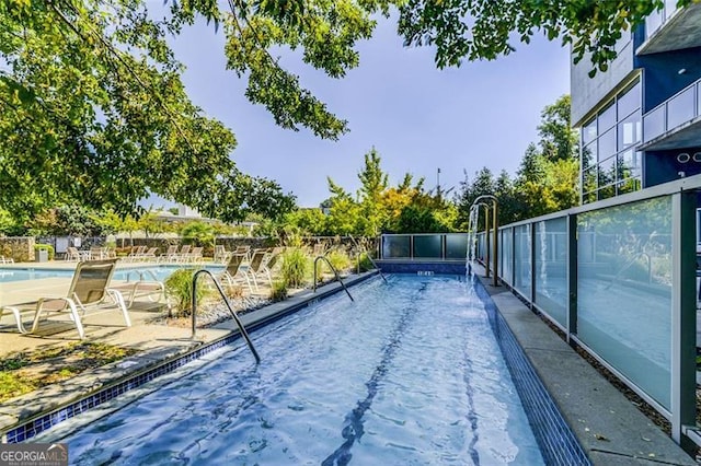 195 Arizona Ave Unit 104, Atlanta, GA 30307 - community pool featuring a patio and fence