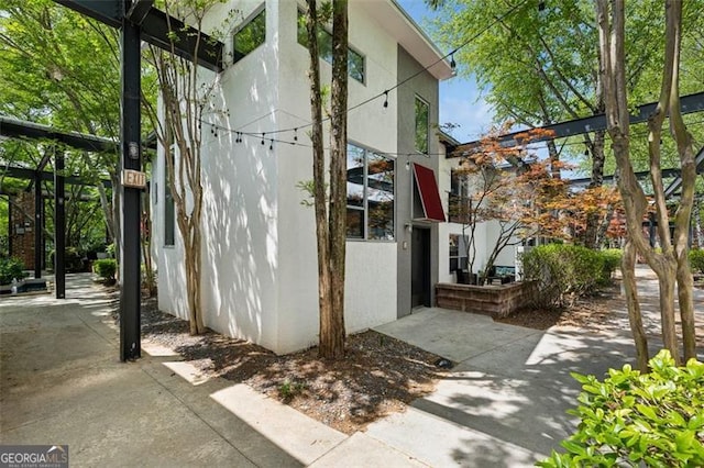 195 Arizona Ave Unit 104, Atlanta, GA 30307 - view of side of home featuring stucco siding