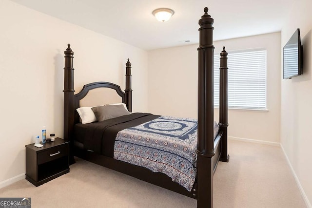 125 Leveret Rd, Locust Grove, GA 30248 - bedroom featuring light carpet and baseboards