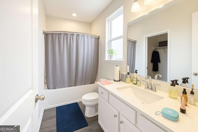 125 Leveret Rd, Locust Grove, GA 30248 - bathroom featuring toilet, vanity, shower / tub combo with curtain, wood finished floors, and recessed lighting