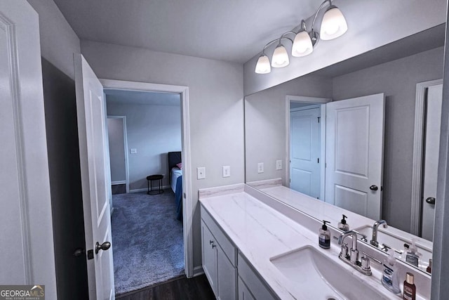 125 Leveret Rd, Locust Grove, GA 30248 - bathroom with vanity, wood finished floors, and baseboards