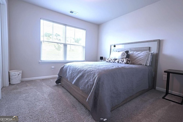 125 Leveret Rd, Locust Grove, GA 30248 - carpeted bedroom featuring baseboards