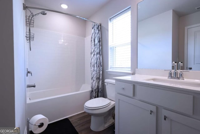 125 Leveret Rd, Locust Grove, GA 30248 - bathroom with toilet, shower / bath combo with shower curtain, wood finished floors, vanity, and recessed lighting
