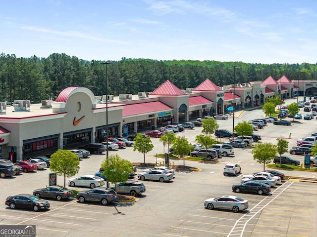 125 Leveret Rd, Locust Grove, GA 30248 - aerial view of a commercial area and a heavily wooded area