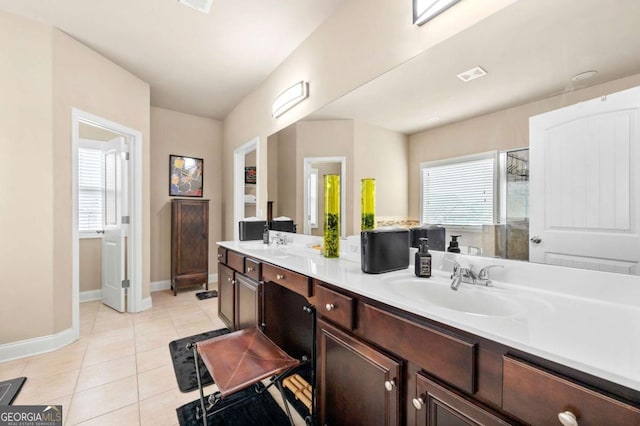 3755 Lake Haven Way, Atlanta, GA 30349 - bathroom with baseboards, tile patterned floors, double vanity, and a stall shower