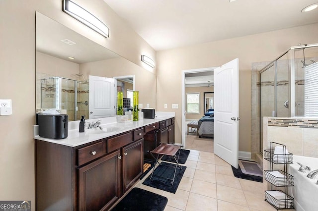 3755 Lake Haven Way, Atlanta, GA 30349 - ensuite bathroom featuring a shower stall, vanity, tile patterned flooring, and a bath