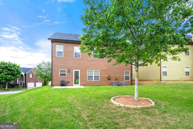 3755 Lake Haven Way, Atlanta, GA 30349 - back of house featuring central air condition unit, a yard, and a patio