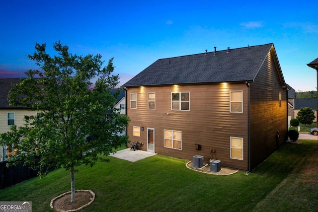 3755 Lake Haven Way, Atlanta, GA 30349 - back of house featuring a yard, a patio, cooling unit, and a shingled roof