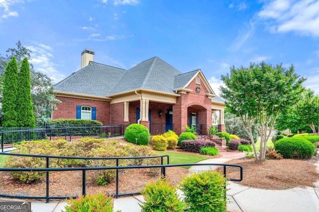 3755 Lake Haven Way, Atlanta, GA 30349 - view of front of house with brick siding, a chimney, roof with shingles, and a porch