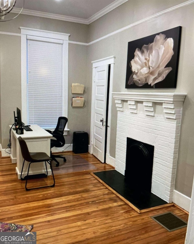 394 Broad St, Milledgeville, GA 31062 - office with visible vents, ornamental molding, baseboards, and wood finished floors
