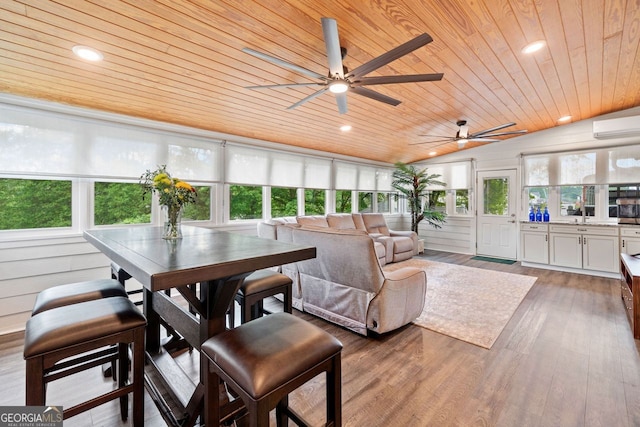 3415 Trickum Rd, Woodstock, GA 30188 - sunroom featuring wood ceiling, wood finished floors, an AC wall unit, and recessed lighting