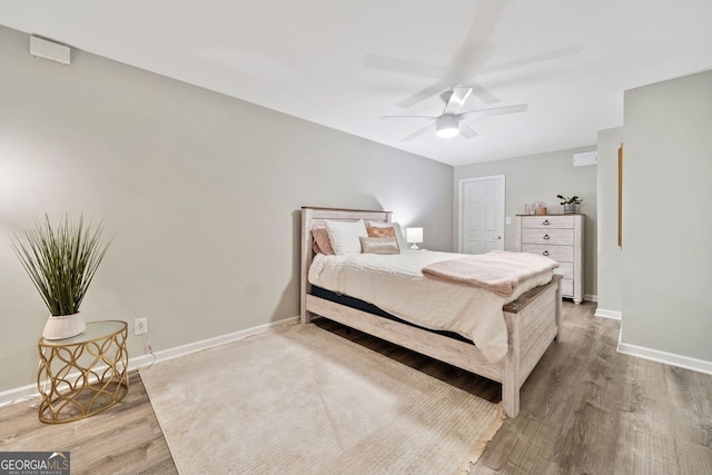 3415 Trickum Rd, Woodstock, GA 30188 - bedroom with wood finished floors, baseboards, and a ceiling fan