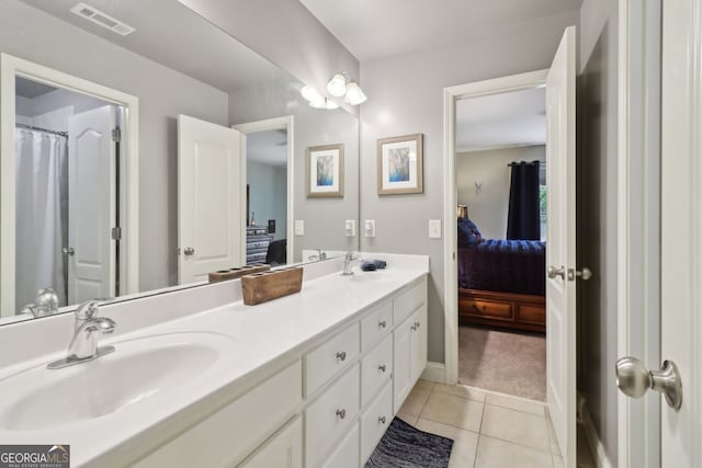 121 Ridge View Dr, Ball Ground, GA 30107 - ensuite bathroom with double vanity and tile patterned floors