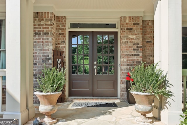 121 Ridge View Dr, Ball Ground, GA 30107 - doorway to property with french doors, brick siding, and covered porch