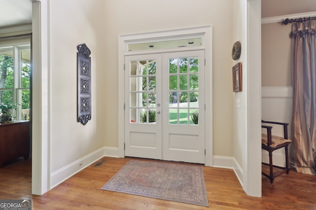 121 Ridge View Dr, Ball Ground, GA 30107 - entryway with light wood finished floors, french doors, and ornamental molding