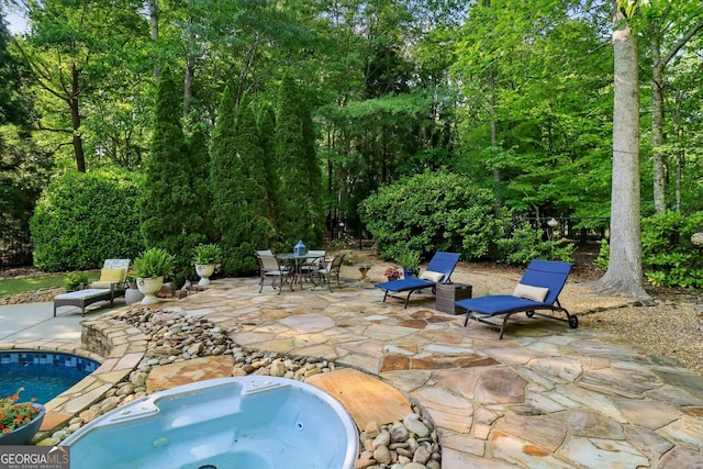 121 Ridge View Dr, Ball Ground, GA 30107 - view of patio / terrace with an outdoor hot tub, outdoor dining space, and a pool