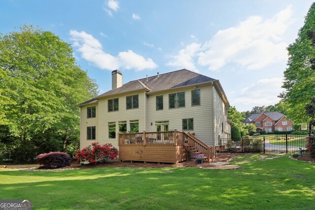 121 Ridge View Dr, Ball Ground, GA 30107 - rear view of house featuring a chimney and a wooden deck