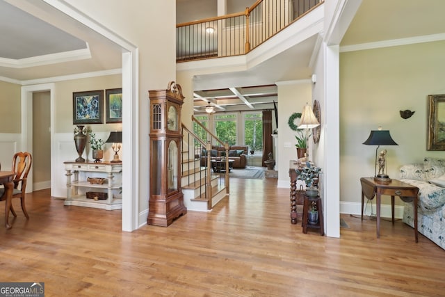 121 Ridge View Dr, Ball Ground, GA 30107 - foyer entrance with crown molding, light wood-style flooring, stairway, coffered ceiling, and ceiling fan