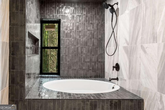 5020 Vallo Vista Ct, Atlanta, GA 30342 - bathroom featuring tiled shower / bath