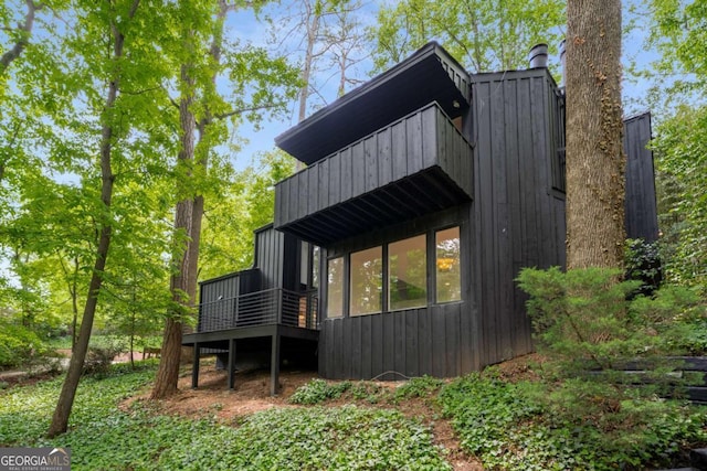5020 Vallo Vista Ct, Atlanta, GA 30342 - view of home's exterior featuring a deck