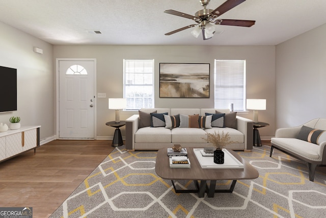 67 Jennifer Ln, Rydal, GA 30171 - living room featuring ceiling fan, baseboards, visible vents, and wood finished floors