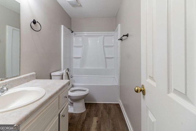67 Jennifer Ln, Rydal, GA 30171 - full bathroom with vanity, wood finished floors,  shower combination, and a textured ceiling