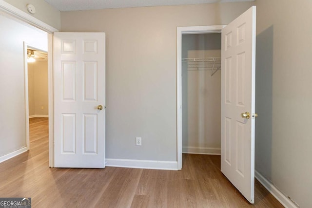 67 Jennifer Ln, Rydal, GA 30171 - unfurnished bedroom with wood finished floors and a closet
