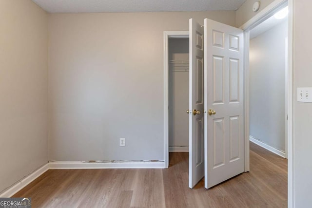 67 Jennifer Ln, Rydal, GA 30171 - unfurnished bedroom with wood finished floors and a closet