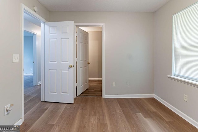 67 Jennifer Ln, Rydal, GA 30171 - unfurnished bedroom featuring wood finished floors and baseboards