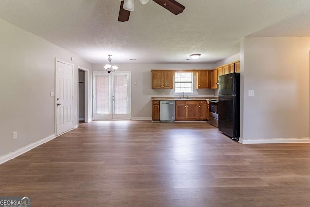 67 Jennifer Ln, Rydal, GA 30171 - kitchen featuring a sink, dark wood-style flooring, ceiling fan with notable chandelier, and appliances with stainless steel finishes