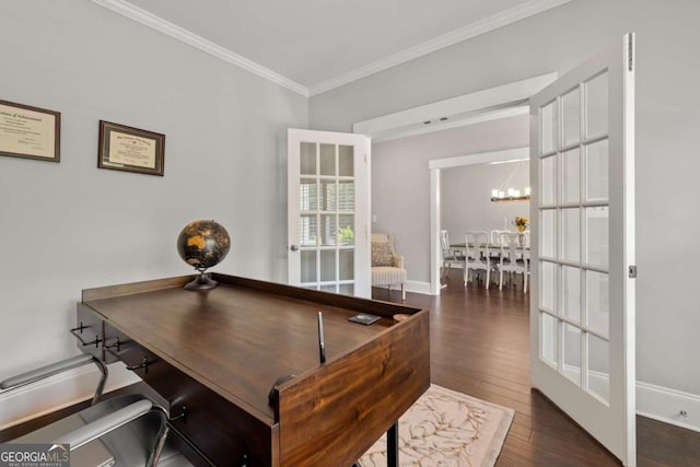 office featuring crown molding, baseboards, an inviting chandelier, and wood finished floors