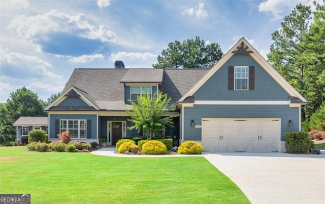 1202 Shiva Blvd, Winder, GA 30680 - craftsman house with driveway, a front lawn, and an attached garage