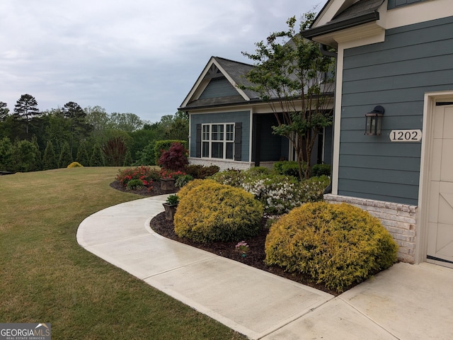 1202 Shiva Blvd, Winder, GA 30680 - view of property exterior with a lawn and brick siding