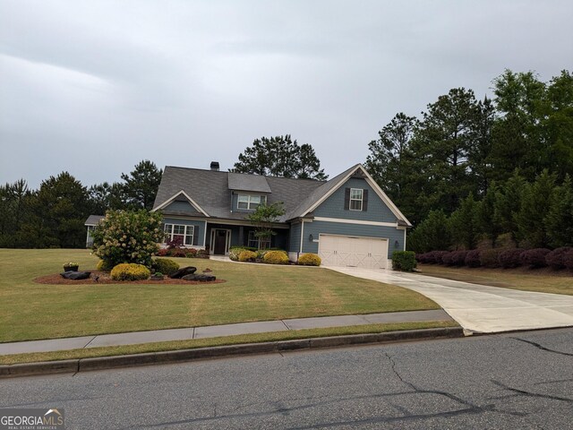 1202 Shiva Blvd, Winder, GA 30680 - craftsman inspired home with concrete driveway, a front lawn, and a garage