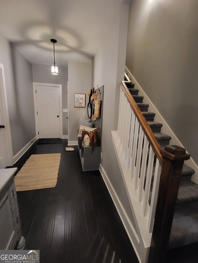 1202 Shiva Blvd, Winder, GA 30680 - foyer featuring stairs, dark wood-style flooring, and baseboards