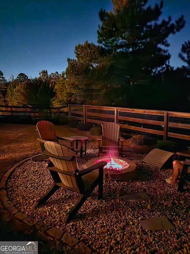 1202 Shiva Blvd, Winder, GA 30680 - view of patio featuring a fire pit