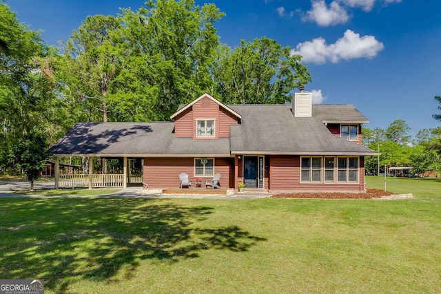 exterior space with a chimney, a front yard, and a carport