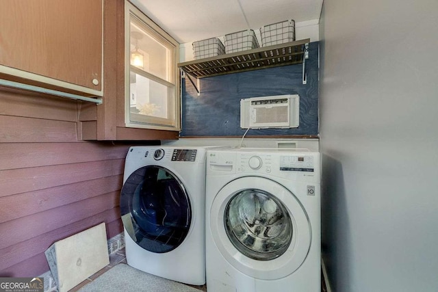 laundry room with cabinet space and washer and clothes dryer
