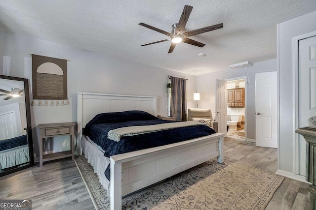 bedroom featuring connected bathroom, a ceiling fan, a textured ceiling, and wood finished floors