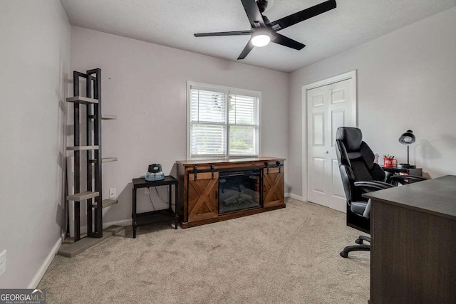 office with baseboards, ceiling fan, and carpet