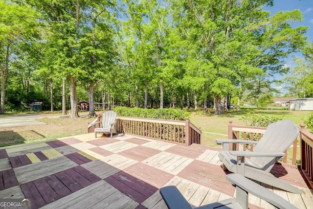 wooden terrace with a yard